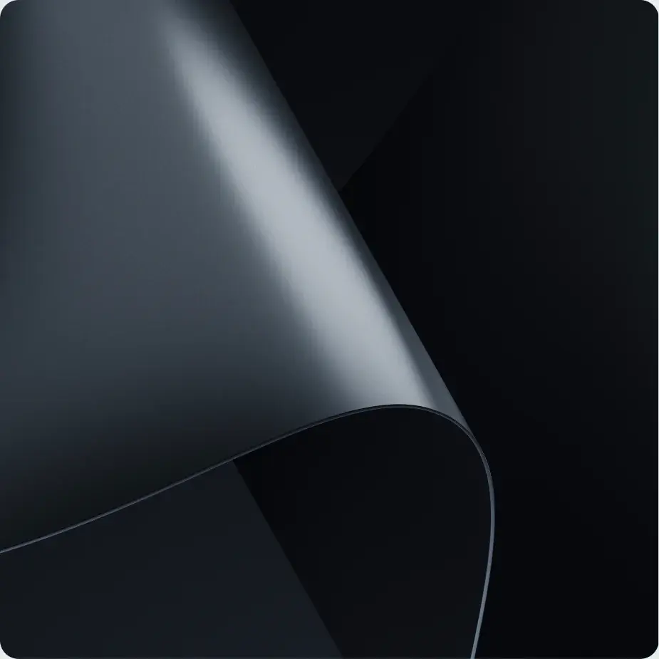 A dark curved surface folding over itself
